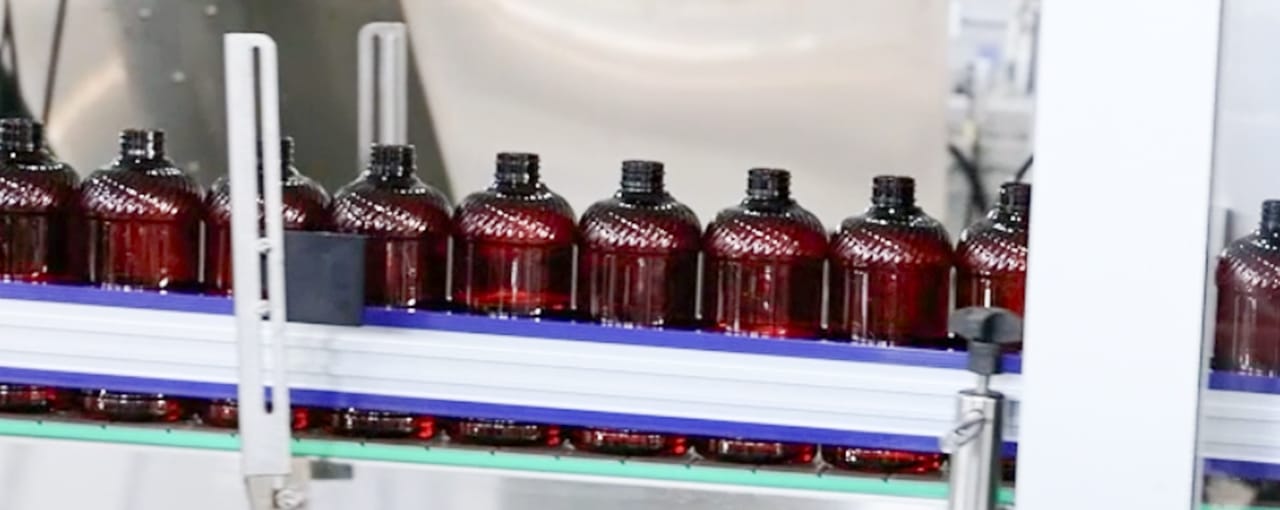 Bottles positioned close together before capping