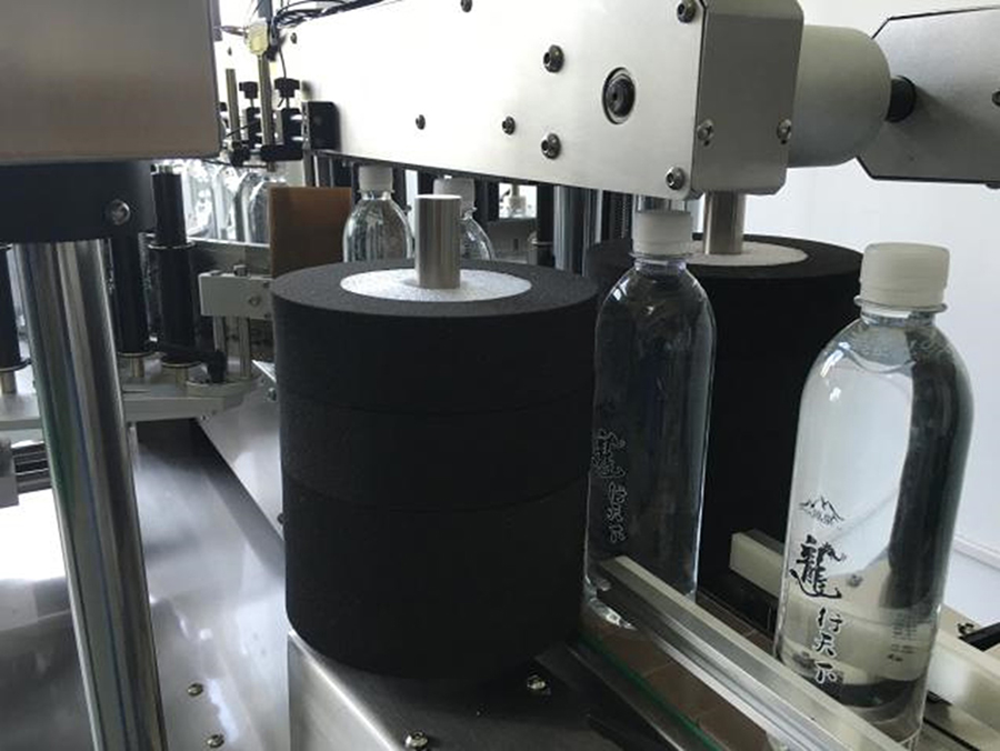 TRPACK Label Dispensing and Attaching Mechanism